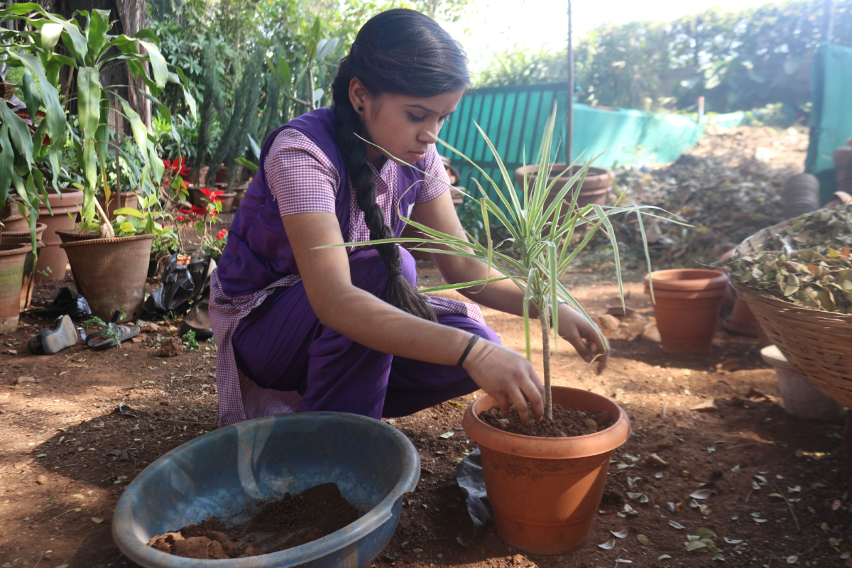 Students learning gardening and nursery skills at Karigar