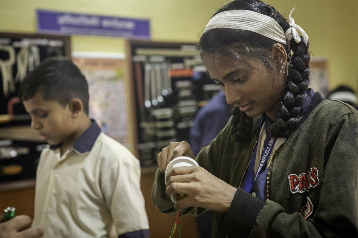 Student developing woodworking skills through hands-on learning at Karigar